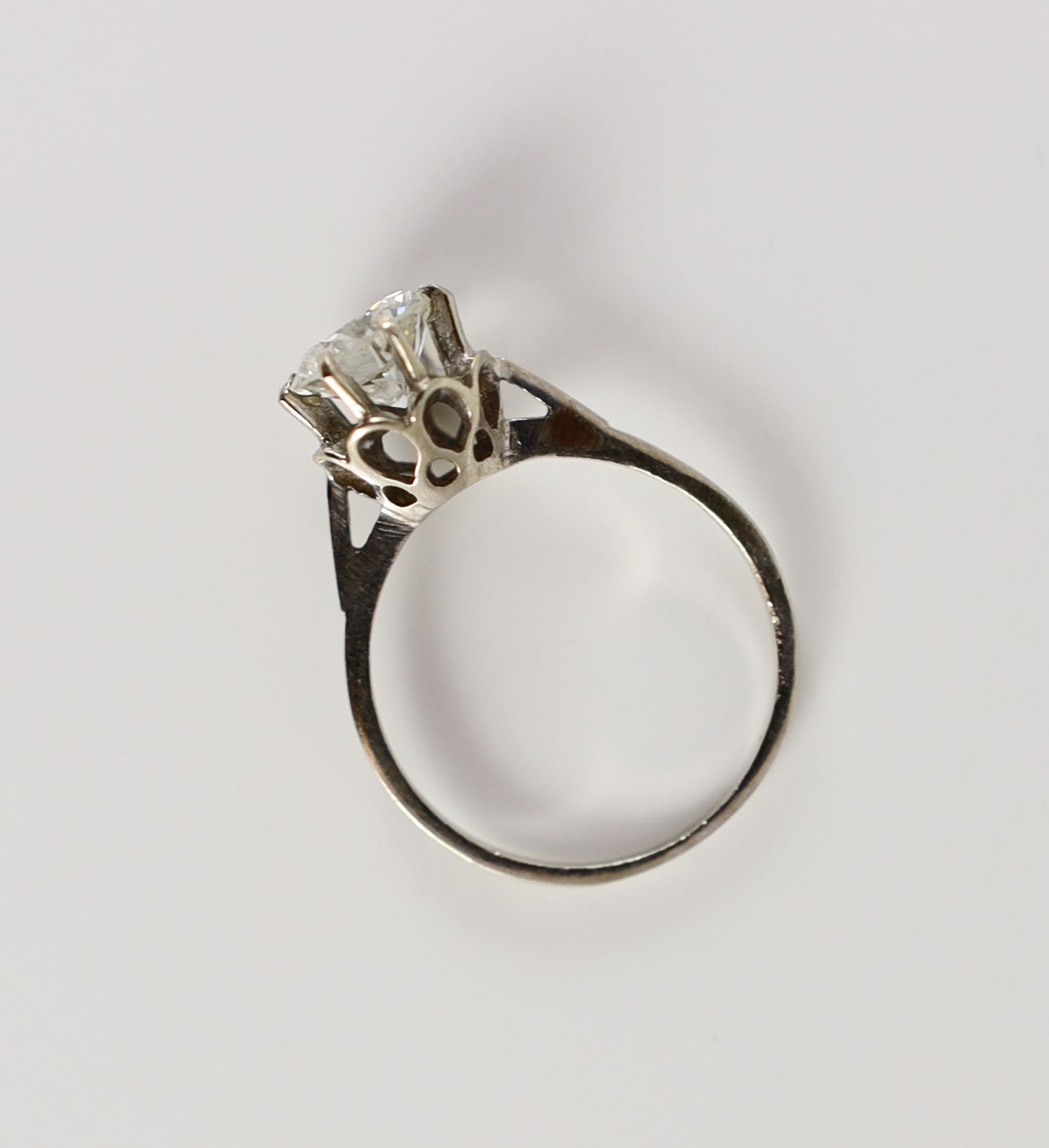 A Continental white gold and solitaire diamond set ring